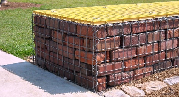 brick stacked in gabion basket