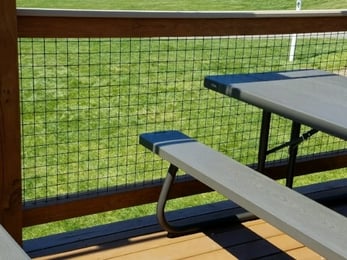 deck with fence panels and picnic table