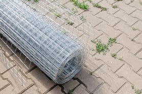 Galv After mesh fence on paving stones