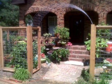 fence gate entry to brick home