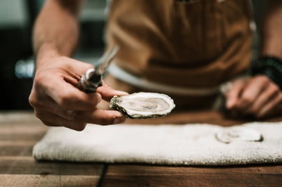 shucking oyster